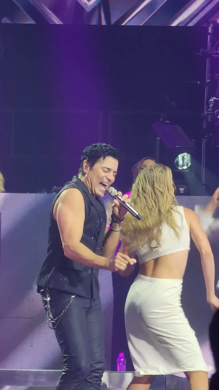 a man singing into a microphone