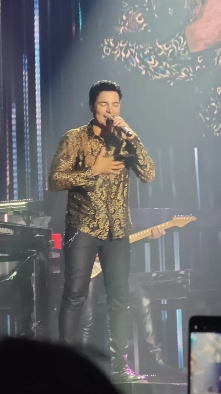 a man singing into a microphone