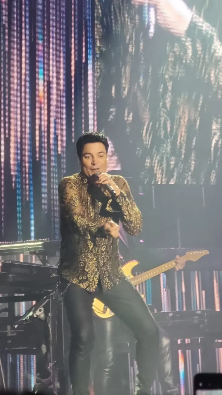 a man singing into a microphone