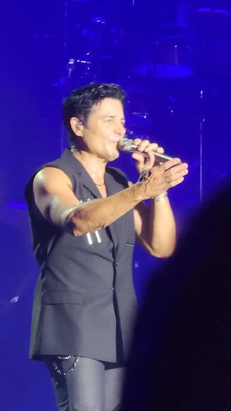 a man singing into a microphone