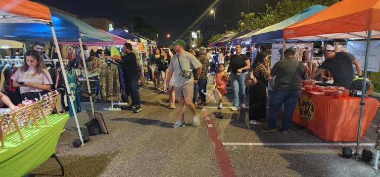 a group of people at a street market