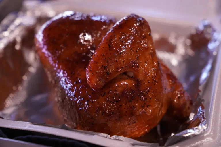 a cooked chicken in a tray