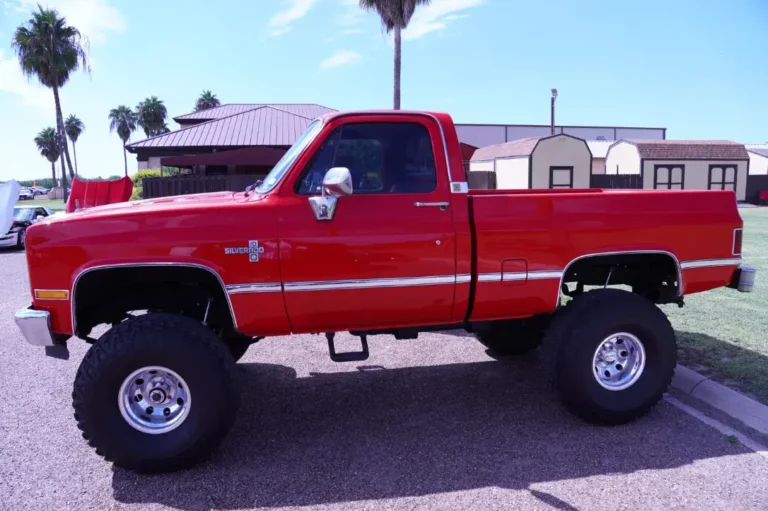 a red truck with big tires