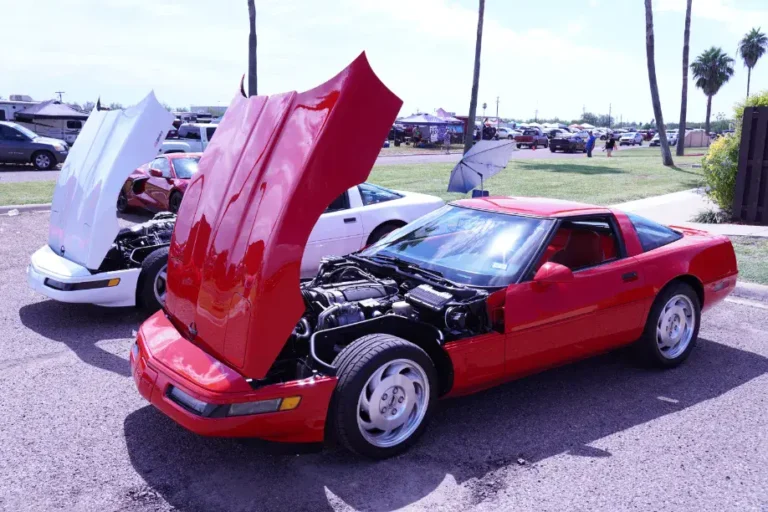 a red car with its hood open