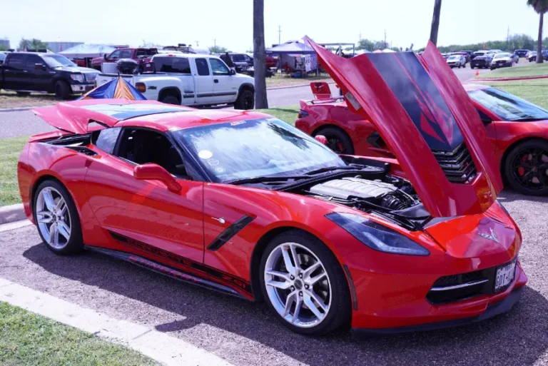 a red sports car with its hood open