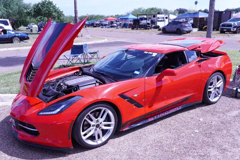 a red sports car with its hood open