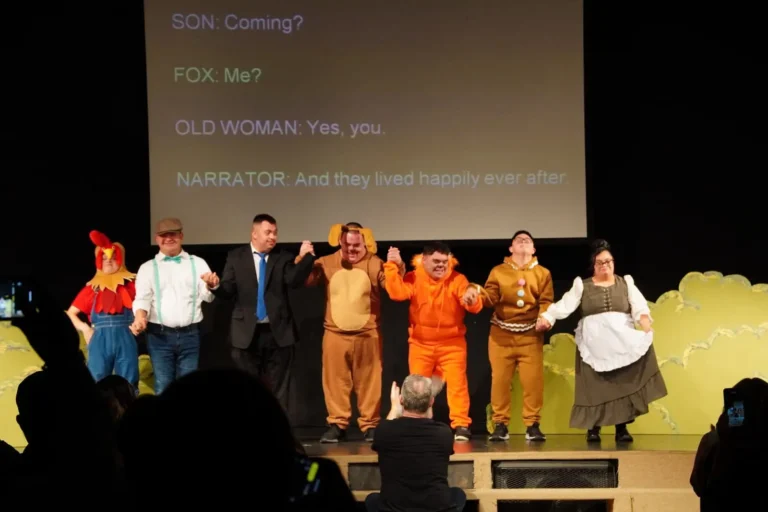 a group of people in clothing on a stage