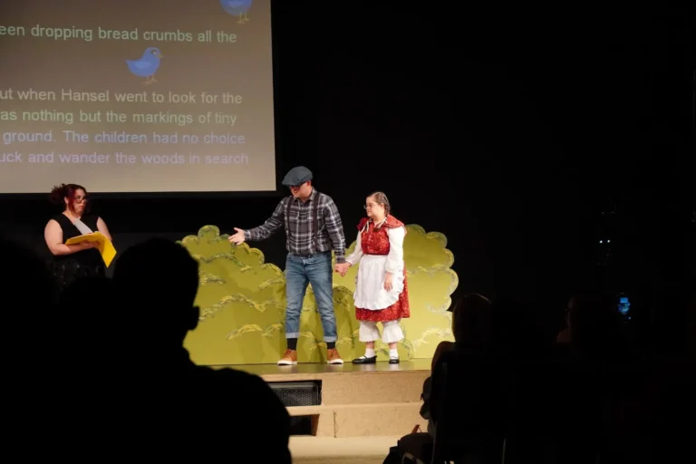 a man and woman on stage